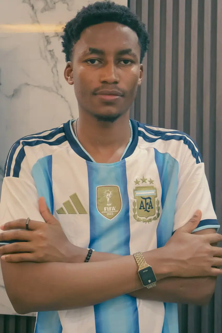 A supporter in the Argentina champions jersey, arms folded